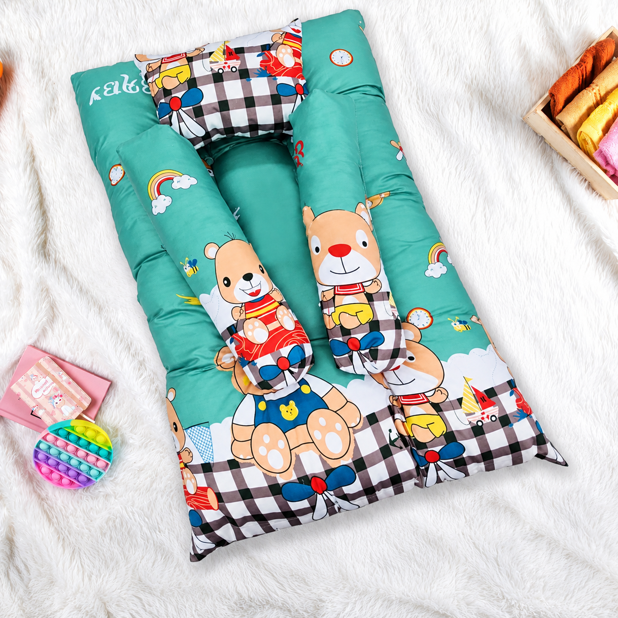 Teal baby lounger cushion featuring cartoon deer, bears, and foxes.